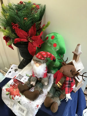 Christmas greenery arrangement with plush Santa and reindeer and decorative church - Image 1 of 4