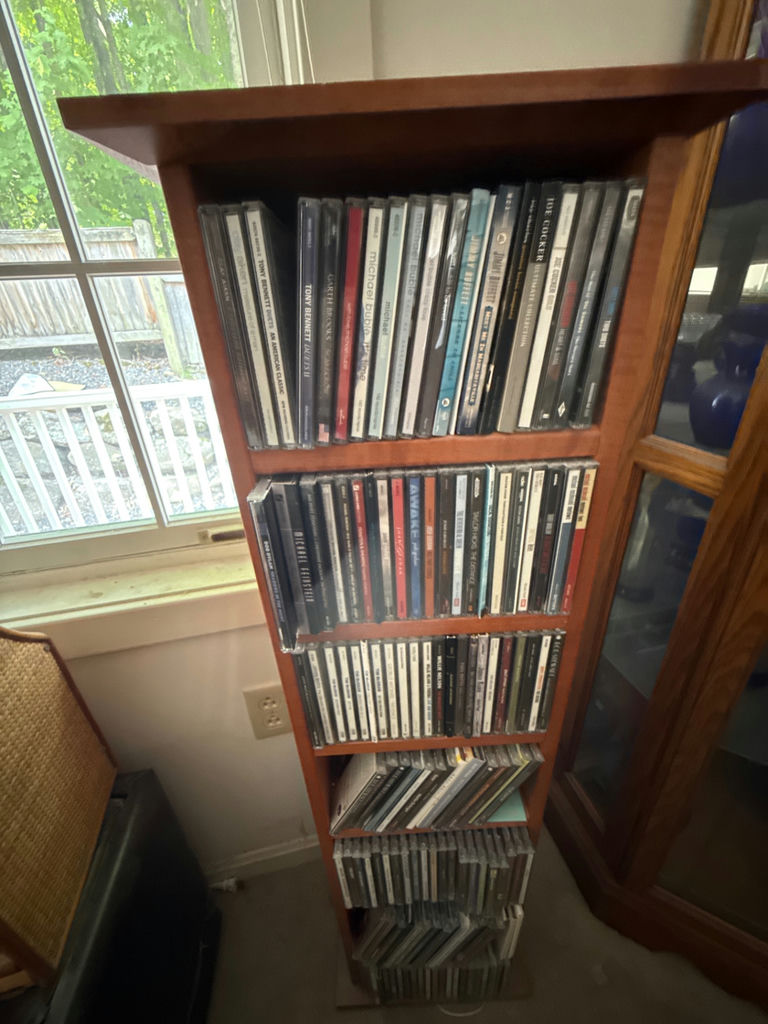 CD collection on wooden shelf - image 2 of 5