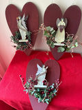 Three rustic wooden heart ornaments with angel figurines - thumbnail 1 of 3