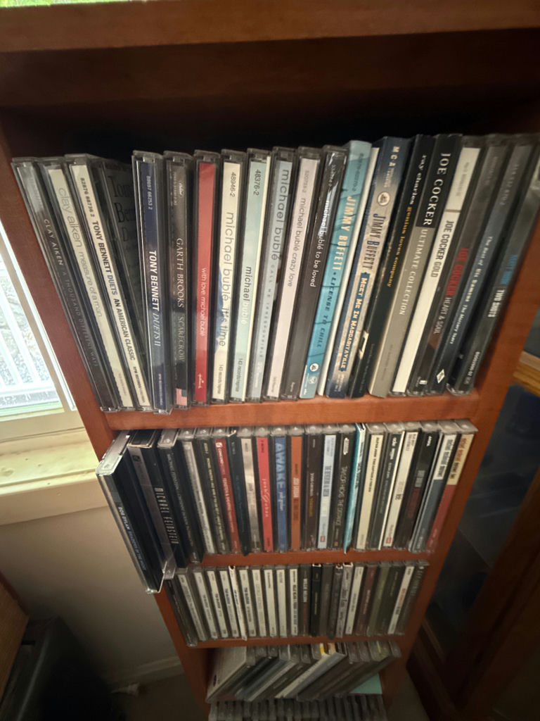 CD collection on wooden shelf - image 3 of 5