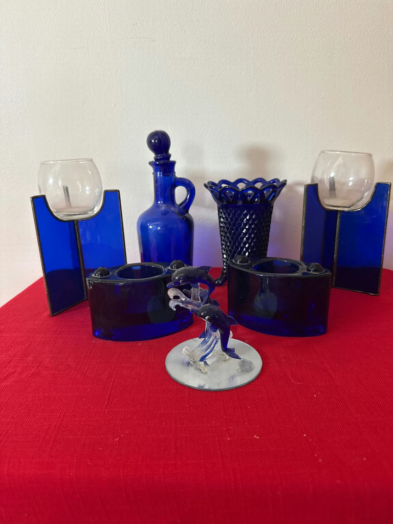 Cobalt blue and blue glassware collection with decorative sculpture - image 1 of 4