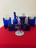 Cobalt blue and blue glassware collection with decorative sculpture - thumbnail 1 of 4