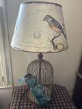 Birdcage-style table lamp with printed shade and blue decorative birds - thumbnail 1 of 1