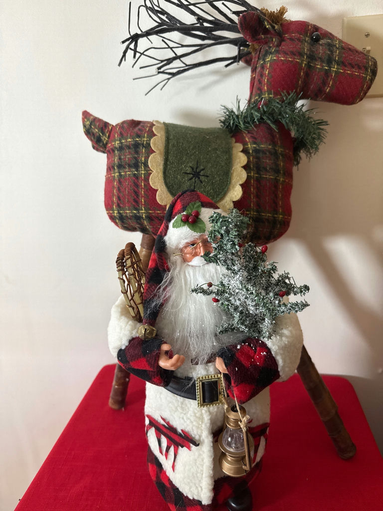 Plaid Santa figure in front of plaid reindeer sculpture - image 3 of 3