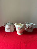 Three floral porcelain creamer and sugar bowl set - thumbnail 1 of 4