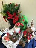 Christmas greenery arrangement with plush Santa and reindeer and decorative church - thumbnail 2 of 4
