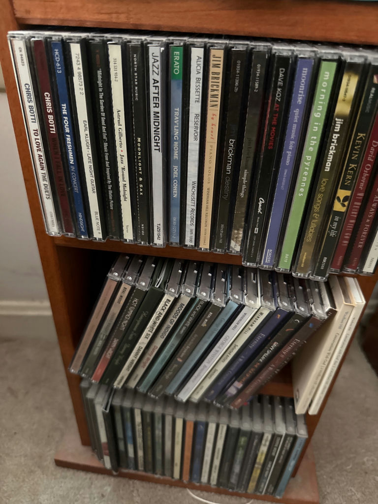 CD collection on wooden shelf - image 5 of 5