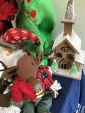 Christmas greenery arrangement with plush Santa and reindeer and decorative church - thumbnail 3 of 4