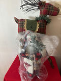 Plaid Santa figure in front of plaid reindeer sculpture - thumbnail 2 of 3