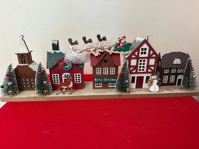 New in box - Christmas village with houses, trees, and holiday figures - Image 1 of 2