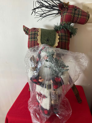 Plaid Santa figure in front of plaid reindeer sculpture - Image 1 of 3