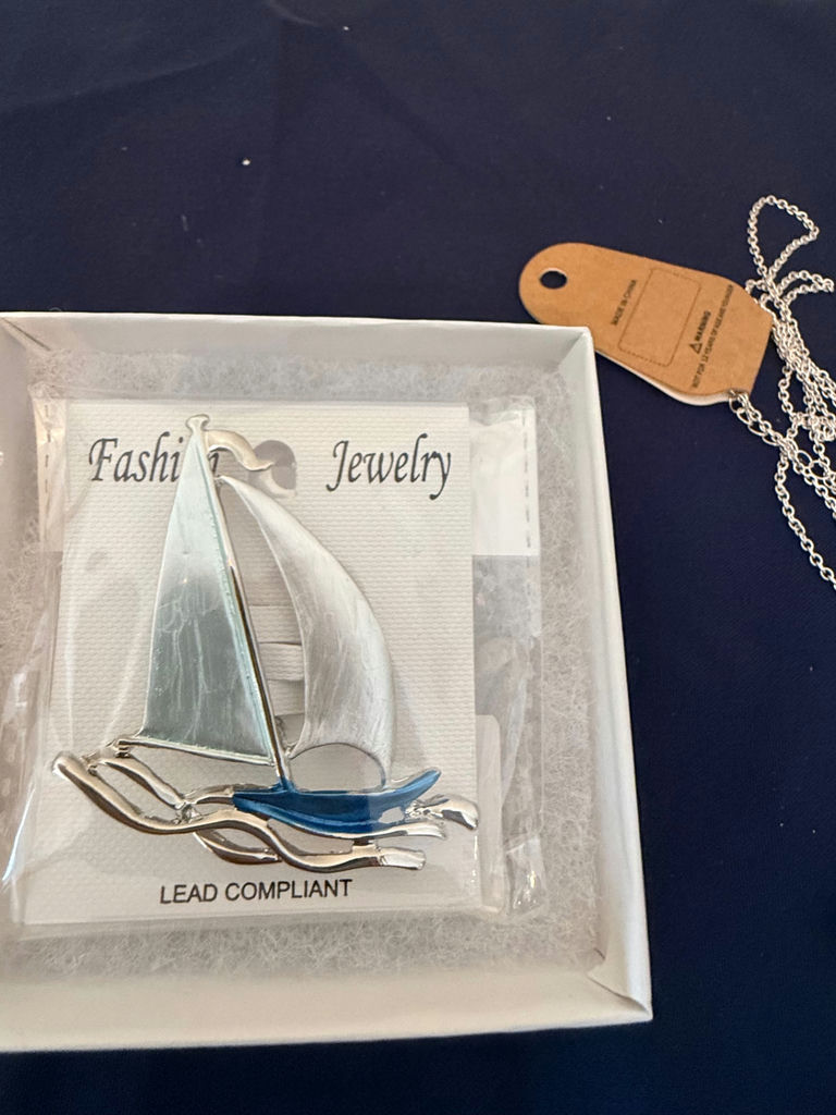 Assorted fashion jewelry: sailboat pendant, dragonfly brooch, and shell charms - image 2 of 4