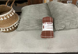 Woven throw blanket, straw basket with tassels, grey cushions, and tassel rug - thumbnail 1 of 8