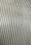 Woven throw blanket, straw basket with tassels, grey cushions, and tassel rug - thumbnail 8 of 8