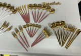 Gold-tone flatware set with white and pink handles and wooden-handled utensils - thumbnail 6 of 10
