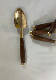 Gold-tone flatware set with white and pink handles and wooden-handled utensils - thumbnail 10 of 10