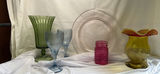 Green hurricane vase, blue ribbed goblets, pink textured jar, amber vase with red rim, and silver plate - thumbnail 1 of 5