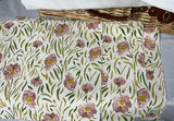 Wicker picnic baskets with blue floral and yellow dinnerware, glassware, and linens - thumbnail 11 of 12
