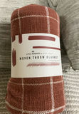 Woven throw blanket, straw basket with tassels, grey cushions, and tassel rug - thumbnail 4 of 8