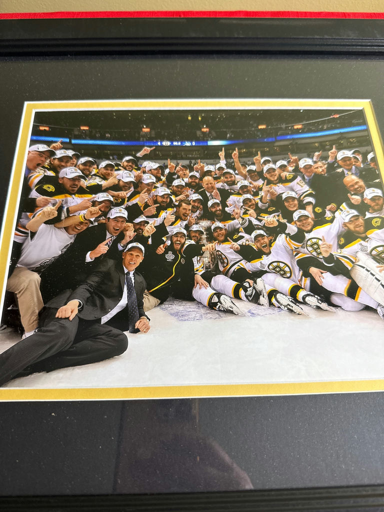 Framed group photo of a Bruins team celebration - image 2 of 3