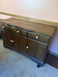 Dark wood sideboard with drawers and cabinet doors - thumbnail 1 of 2
