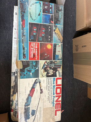 Lionel model railroad set with locomotive, freight cars, and track - Image 1 of 3
