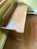 Wooden storage bench with sticker-covered interior - thumbnail 1 of 3