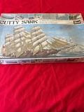 Cutty Sark sailing ship model kit with accompanying model train components - thumbnail 1 of 3