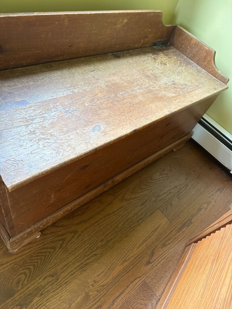 Wooden storage bench with sticker-covered interior - image 2 of 3