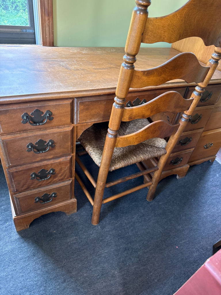 Antique wooden desk with drawers and woven-seat chairs - image 1 of 4