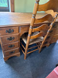 Antique wooden desk with drawers and woven-seat chairs - thumbnail 1 of 4