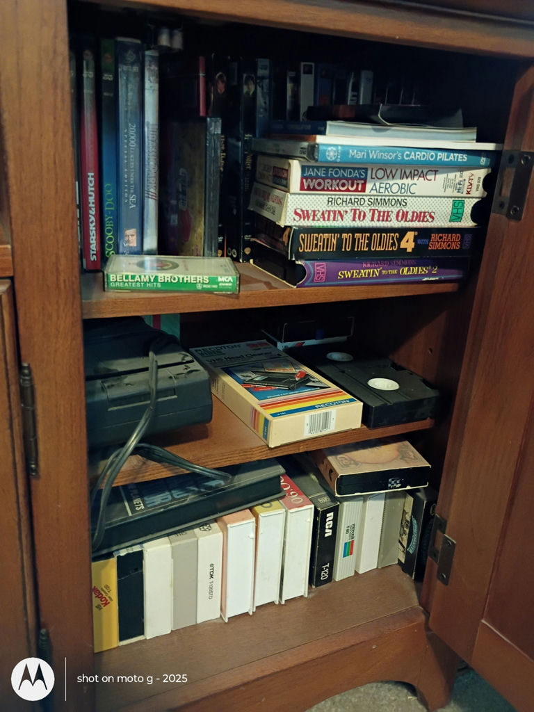 Assorted VHS Tapes, DVDs, and Media Storage Cabinet - image 8 of 8