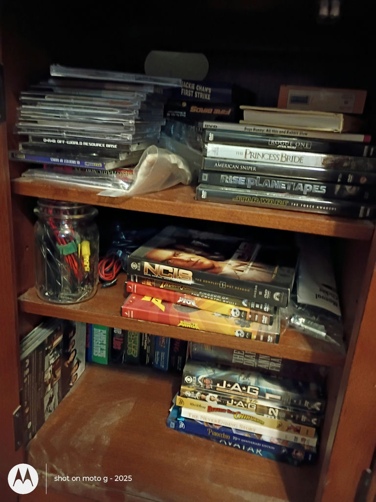 Assorted VHS Tapes, DVDs, and Media Storage Cabinet - image 4 of 8