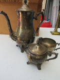 Silver-Tone Tea Service Pieces, Brass Candlesticks, and Metal Mugs - thumbnail 2 of 5