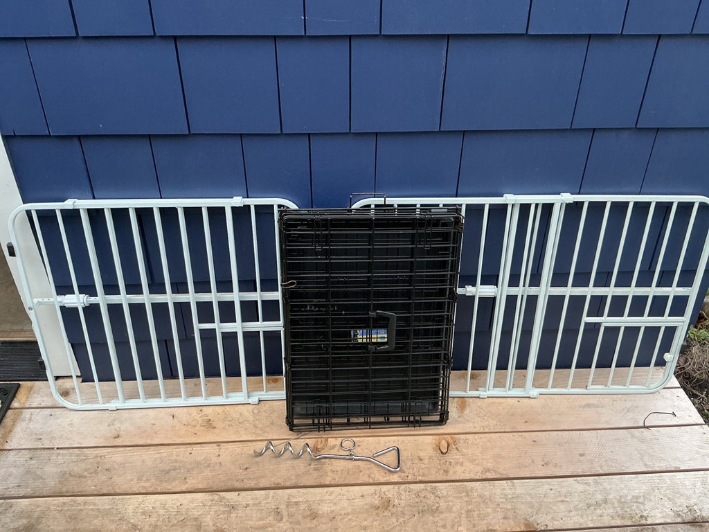 Two expanding white metal pet gates up to 38”  and a pet crate. - image 1 of 6