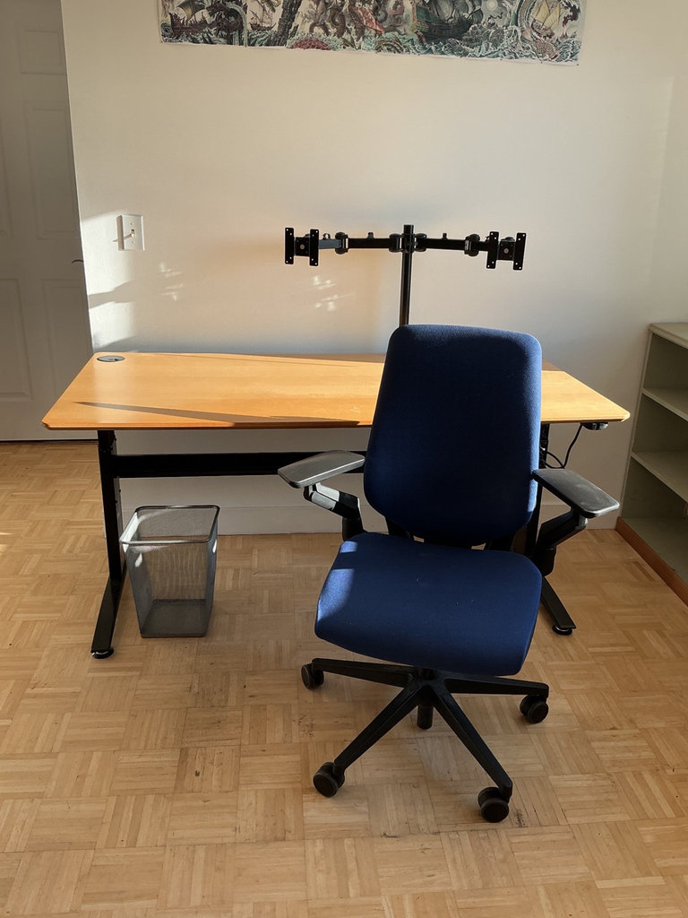 Height-adjustable desk with monitor arm, office chair, and ViewSonic monitors. - image 6 of 13