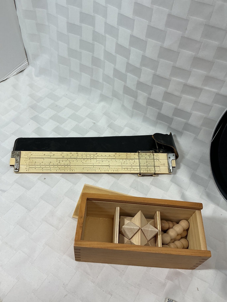 Math-themed clock, slide rule, and vintage desk toys - image 4 of 6