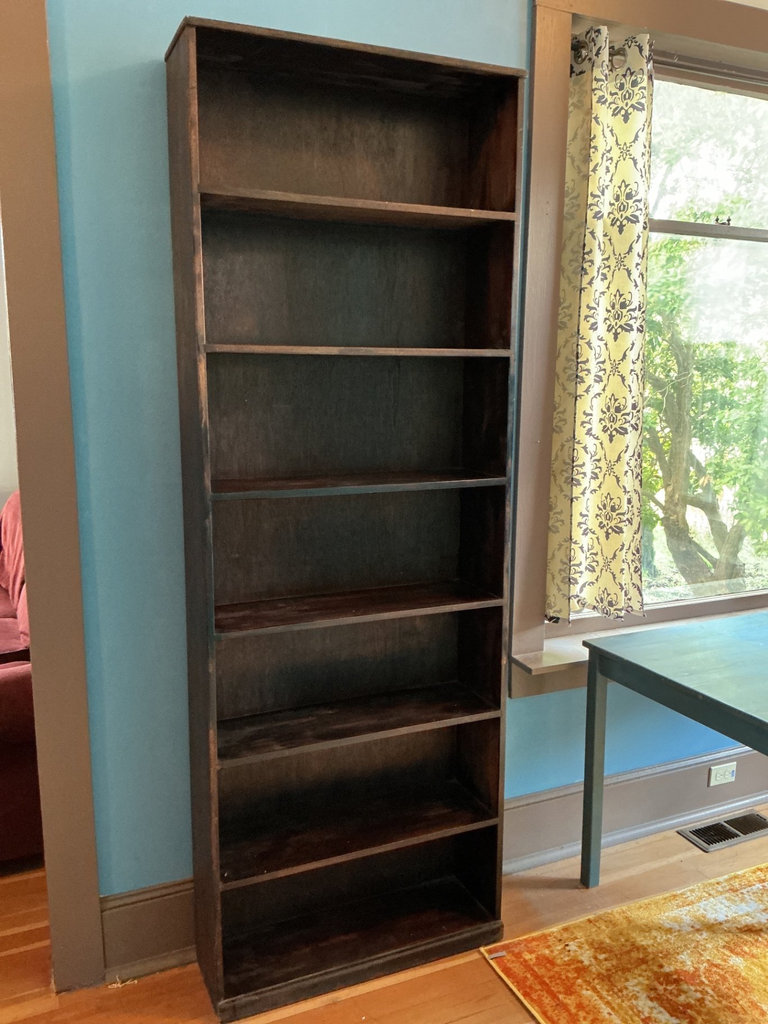 Tall dark wooden bookshelf - image 1 of 3