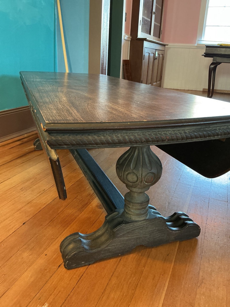 Dark wooden coffee table with ornate carved pedestal bases - image 4 of 7