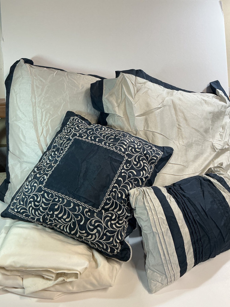 Pillows and Folded Bedding in Cream and Navy - image 1 of 4