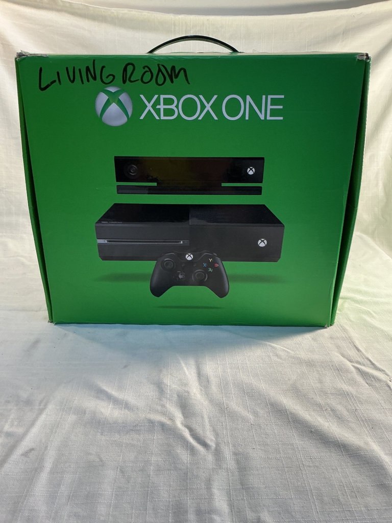 Xbox One X console with three controllers and a game - image 7 of 8