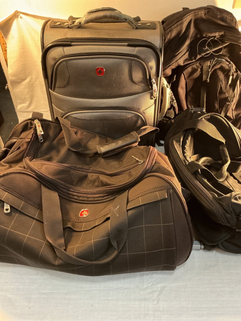 Assorted travel bags: backpack, rolling suitcase, and duffel - image 1 of 11