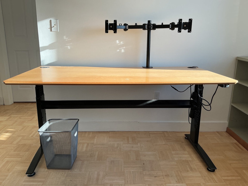 Height-adjustable desk with monitor arm, office chair, and ViewSonic monitors. - image 4 of 13