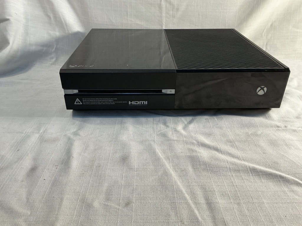 Xbox One X console with three controllers and a game - image 3 of 8
