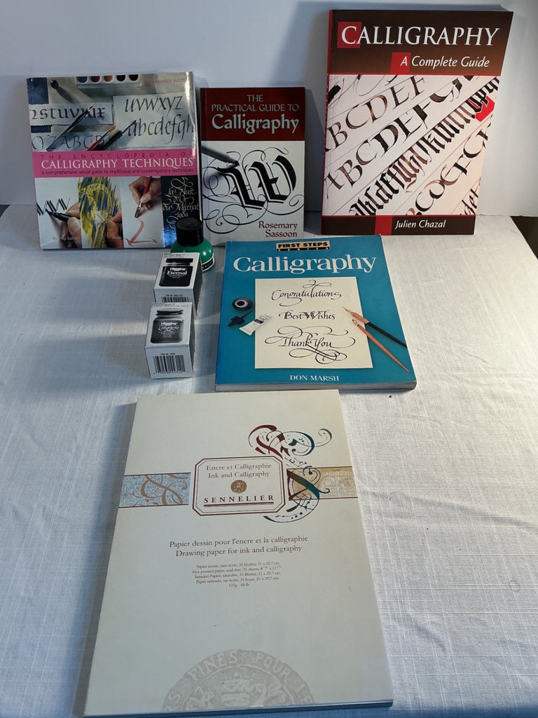 Assorted art supplies and calligraphy books - image 8 of 9