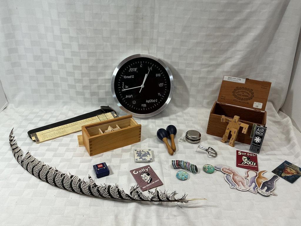Math-themed clock, slide rule, and vintage desk toys - image 1 of 6