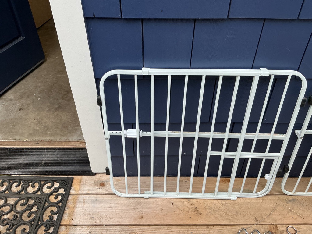 Two expanding white metal pet gates up to 38”  and a pet crate. - image 2 of 6