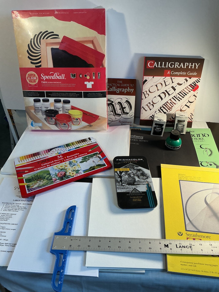 Assorted art supplies and calligraphy books - image 1 of 9