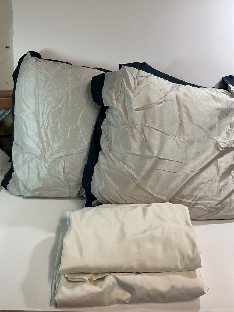 Pillows and Folded Bedding in Cream and Navy - image 2 of 4