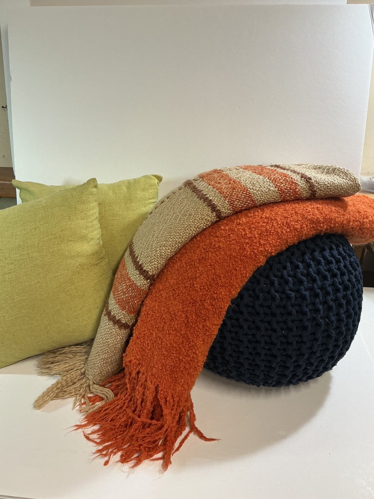 Knitted navy pouf with striped throw and lime cushions - image 1 of 4